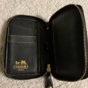 Coach calendar wallet with pen holder.